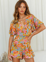 Load image into Gallery viewer, Floral Wrap Tie Romper
